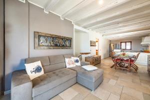 a living room with a couch and a table at Apartment in Cala Gonone 34714 in Cala Gonone