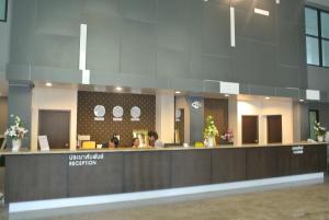 a lobby of a hospital with a reception counter at S Tara Grand in Suratthani