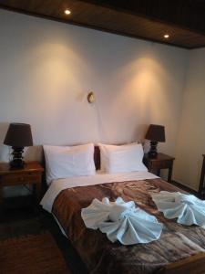 Postel nebo postele na pokoji v ubytování Guesthouse Rousis