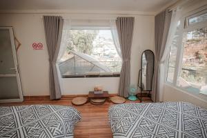 Postel nebo postele na pokoji v ubytování Homestay BỒ CÔNG ANH