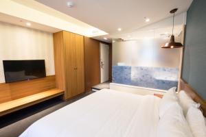 Letto o letti in una camera di Walker Hotel. Ximen