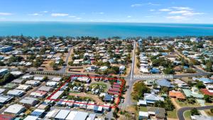 an aerial view of a suburb next to the ocean at Tasman Holiday Parks - Torquay Palms in Hervey Bay