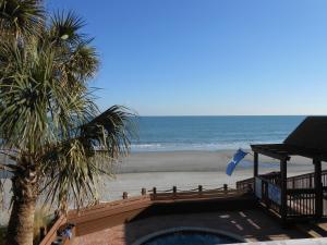 a view of the beach from the balcony of a house at 0105 Waters Edge Resort condo in Myrtle Beach