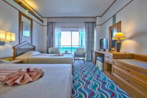 Postel nebo postele na pokoji v ubytování Asia Cha-am Hotel