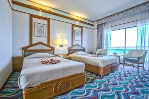 Postel nebo postele na pokoji v ubytování Asia Cha-am Hotel