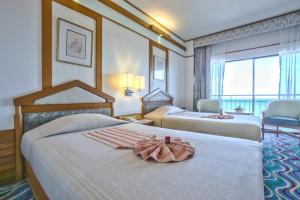 Кровать или кровати в номере Asia Cha-am Hotel