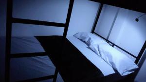 Postel nebo postele na pokoji v ubytování Kimaná Hostal