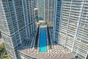 an aerial view of a pool in between two tall buildings at NEW!!! W Brickell Miami- ICON DELUXE LOUNGE with 2 masters in Miami