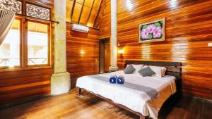 Postel nebo postele na pokoji v ubytování Villa Happy Jimbaran
