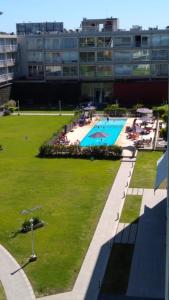 an overhead view of a swimming pool in a building at Concord Zafiro Pilar Apart in Pilar