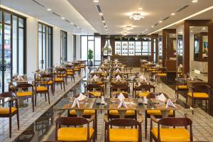 Ресторант или друго място за хранене в Senna Hue Hotel