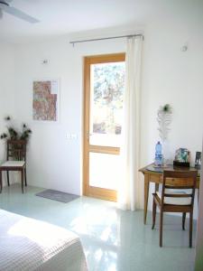 Postel nebo postele na pokoji v ubytování B&B Il Grotto