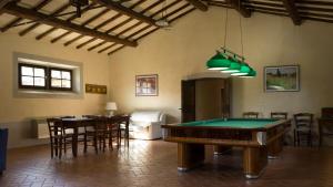 a living room with a pool table in it at Villa Conte Gualtiero in Sarteano