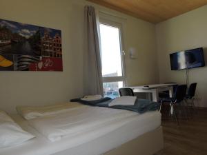 A bed or beds in a room at 211 Amsterdam, Studio Apartment, 30m2 1-4 Pers