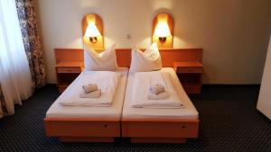 Postelja oz. postelje v sobi nastanitve Hotel Altberesinchen