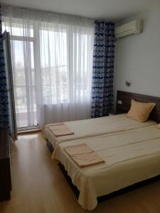 Postel nebo postele na pokoji v ubytování Apartamenti Zhelezovi