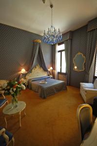 Postel nebo postele na pokoji v ubytování Hotel Torino