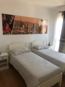En eller flere senge i et værelse på A casa di Titty