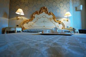 Postel nebo postele na pokoji v ubytování Hotel Torino
