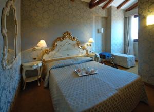 Postel nebo postele na pokoji v ubytování Hotel Torino