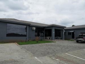 a house with a car parked in a parking lot at Green Olive Panorama in Bethlehem