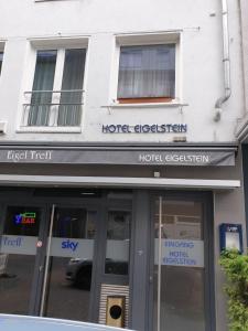 a store front of a hotel with a sign over the door at Hotel Eigelstein in Cologne