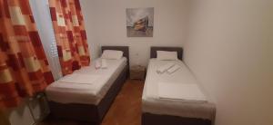 Ein Bett oder Betten in einem Zimmer der Unterkunft Apartment Krajacic