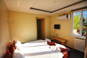 Postel nebo postele na pokoji v ubytování KILIÇ MOTEL