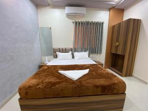 Postel nebo postele na pokoji v ubytování HOTEL DIVINE