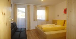 Ένα ή περισσότερα κρεβάτια σε δωμάτιο στο Ferienhaus Marian