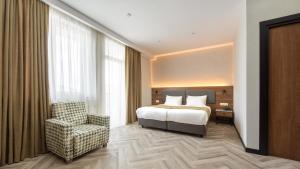 Voodi või voodid majutusasutuse KOMOREBI BAKURIANI RESORT toas