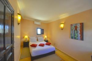 Ένα ή περισσότερα κρεβάτια σε δωμάτιο στο Essaouira Lodge