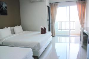 Posteľ alebo postele v izbe v ubytovaní Plus Hotel