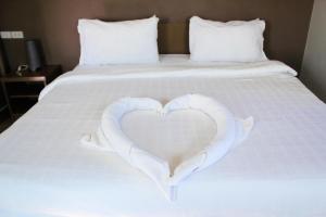 Postel nebo postele na pokoji v ubytování Plus Hotel