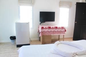 Postel nebo postele na pokoji v ubytování Plus Hotel