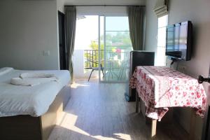 Postel nebo postele na pokoji v ubytování Plus Hotel