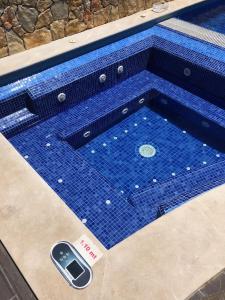 a swimming pool with a cell phone in it at Villa Redonda Jacuzzi Heated Pool in Albufeira