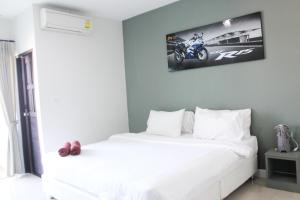 Postel nebo postele na pokoji v ubytování Plus Hotel