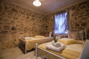 Postel nebo postele na pokoji v ubytování Olive Grove Deluxe apartment