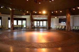 a dance floor in a room with a stage at Nayara Hangaroa in Hanga Roa +37 photos