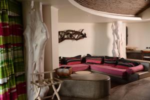 a living room with a couch and a table at Nayara Hangaroa in Hanga Roa