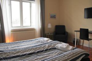 Giường trong phòng chung tại Blåkråkan Bed & Breakfast