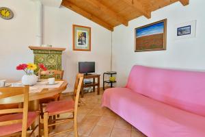 a living room with a couch and a table at Adriatico Bungalow in Poreč
