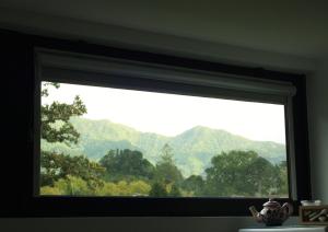 a window with a view of a mountain view at Furnas Springs in Furnas