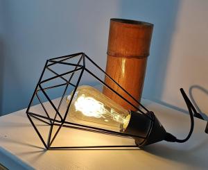 a light in a geometric framework with a candle at Furnas Springs in Furnas