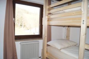 Un pat sau paturi într-o cameră la Apartment Alpenpanorama