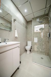 Kylpyhuone majoituspaikassa Rebus Apartments