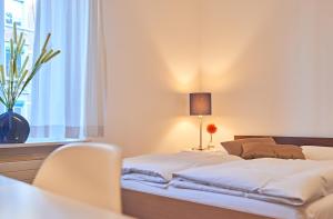Ένα ή περισσότερα κρεβάτια σε δωμάτιο στο Saint Georges Hotel