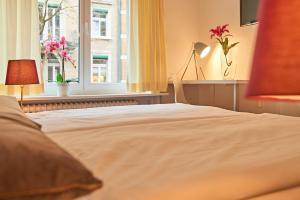 Ένα ή περισσότερα κρεβάτια σε δωμάτιο στο Saint Georges Hotel