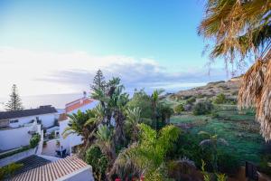 a view of the ocean from a house at PRAINHA BEACH APARTMENT in Luz